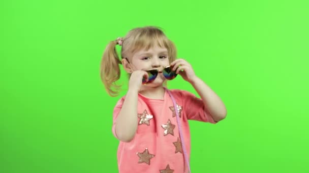 Positive girl in pink blouse and sunglasses dancing and posing. Chroma Key — Stock Video