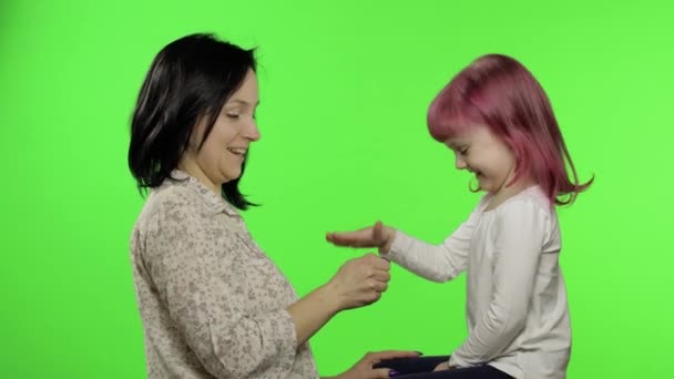 Mother and little daughter playing rock paper scissors. Chroma Key. Leisure game — Stock Video