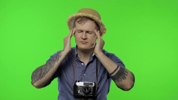 Portrait of man tourist photographer having headache. Chroma key — Stock Video