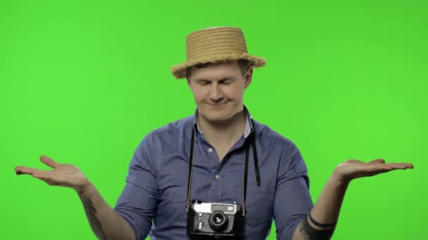 Portrait of young man tourist photographer pointing at something. Chroma key — Stock Video