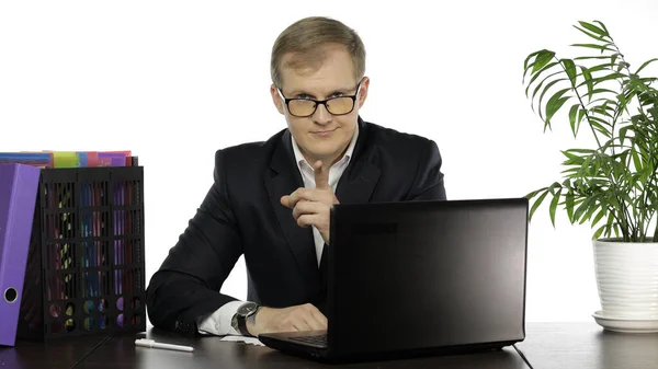 Businessman director in office leaning on table looking and points at camera — Stock Photo, Image