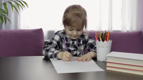 Cute child girl studying drawing picture with pencil at home. Distance education — Stock Video