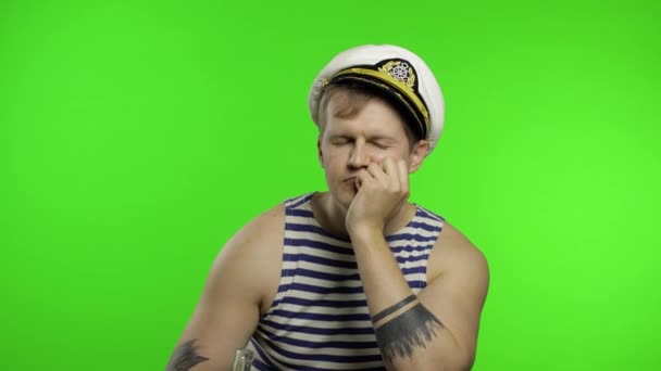 Young sailor man drinks vodka. Seaman guy in sailors vest. Chroma key — Stock Video