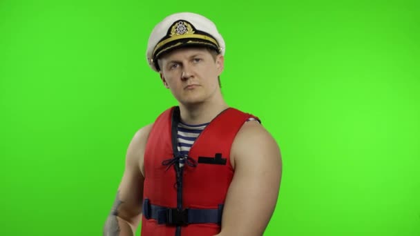 Young muscular sailor man works as lifeguard at beach arms crossed. Chroma key — Stock Video