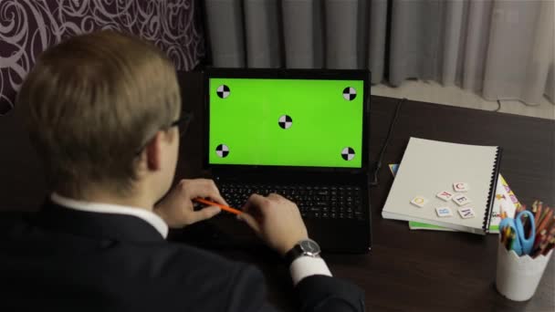 Man teacher making online video call on laptop. Green screen. Distance education — Stock Video