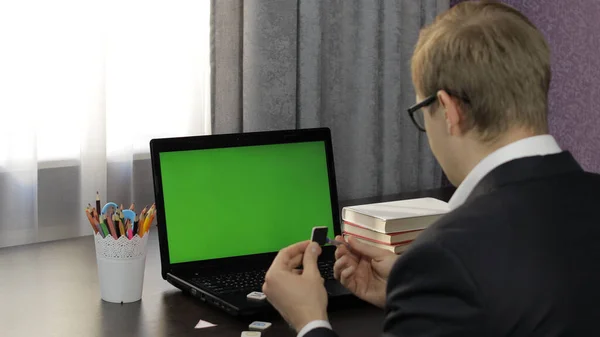 Man teacher making online video call on laptop. Green screen. Distance education — Stock Photo, Image