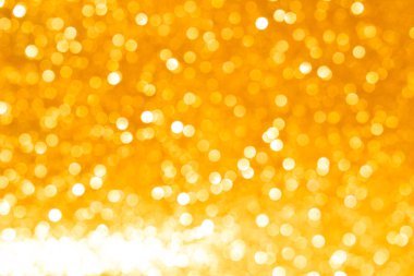 Soyut altın parıltılı arkaplan parıltıları