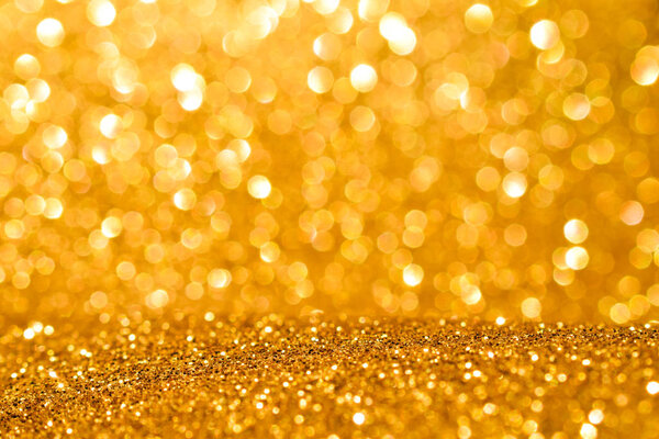 sparkles of golden glitter abstract background