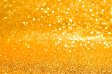 Soyut altın parıltılı arkaplan parıltıları