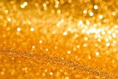 Soyut altın parıltılı arkaplan parıltıları
