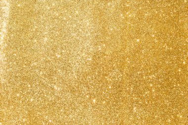 Soyut altın parıltılı arkaplan parıltıları