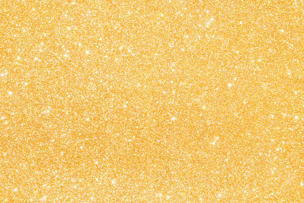 Искры золотого блеска абстрактного фона
