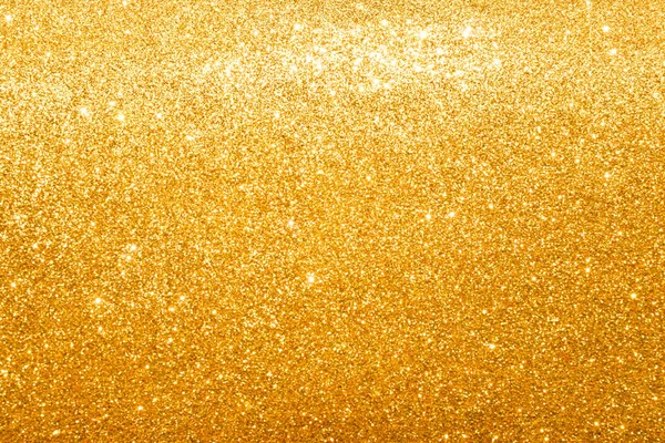 shine and sparkle of golden glitter abstract background