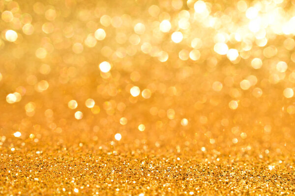 shine and sparkle of golden glitter abstract background
