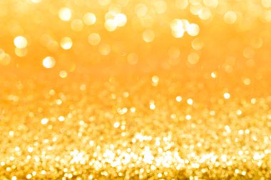 Soyut altın parıltılı arkaplan parıltıları