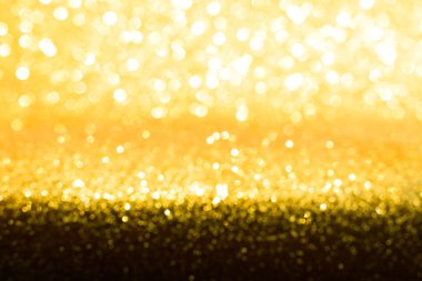 Soyut altın parıltılı arkaplan parıltıları