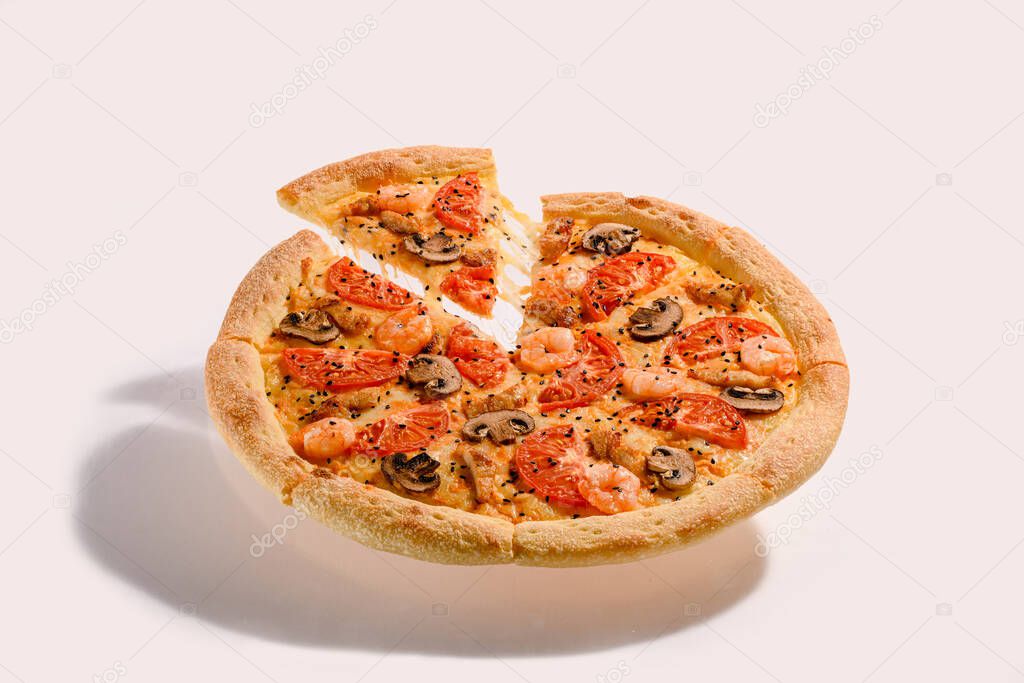 Flying pizza with shrimp and mushroom and slice with stretching cheese