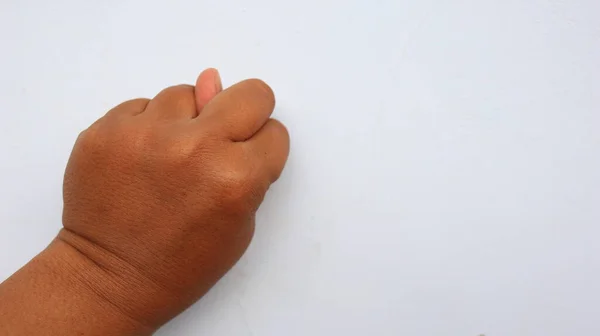Lewa Ręka Sfotografowana Znaczeniem Symbolu Białym Tłem Nieostra Niewyraźne — Zdjęcie stockowe