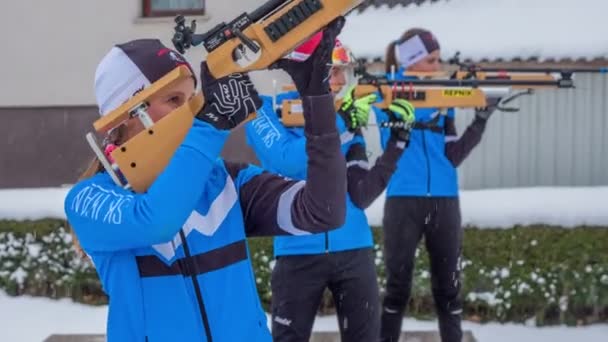 Girls Standing Shooting Rifles Cold Snowy Day — Stock Video