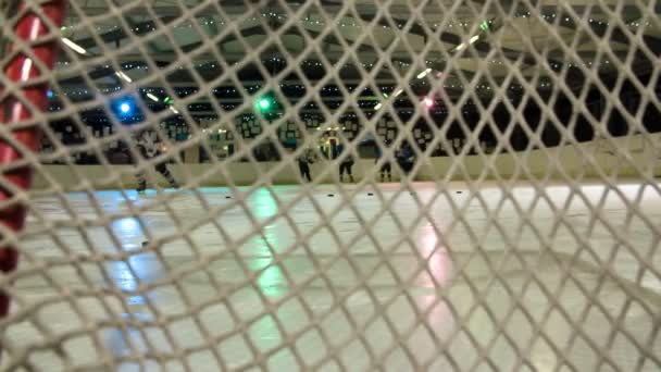 Ice Hockey Player Practising Swatting Pucks Goal Puck Touches Net – Stock-video