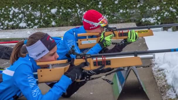 Girls Focused Shooting Rifles Snowing Little Bit — Stock Video