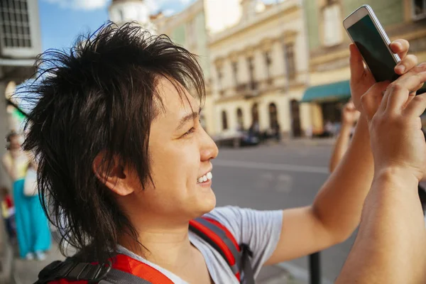 Young Asian Tourist taking picture — Stock Photo, Image