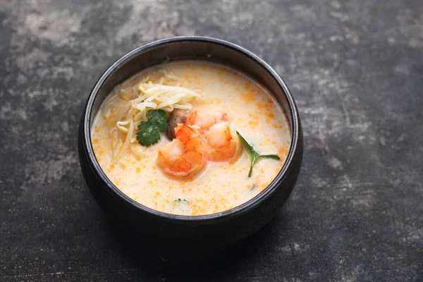 Spicy soup with coconut milk, shrimps and mushrooms.Traditional Japanese soup with coconut milk, shrimps and mushrooms.