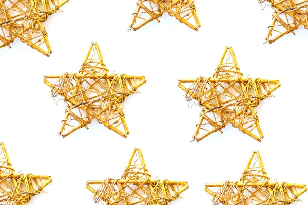 Christmas pattern with golden stars isolated on white background. Copy space.