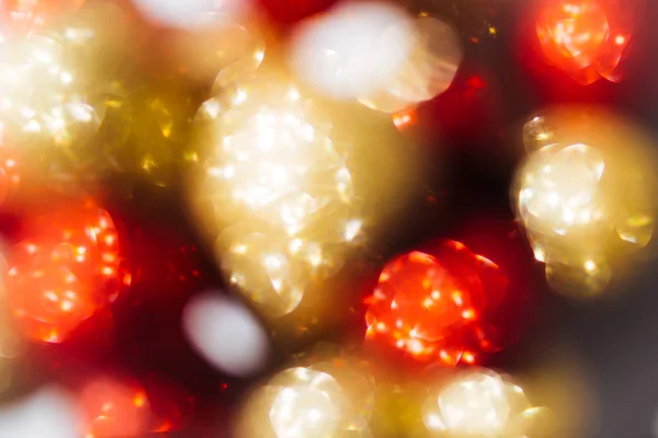 Blurred bokeh with golden and red balls. Abstract festive background. — Stock Photo, Image