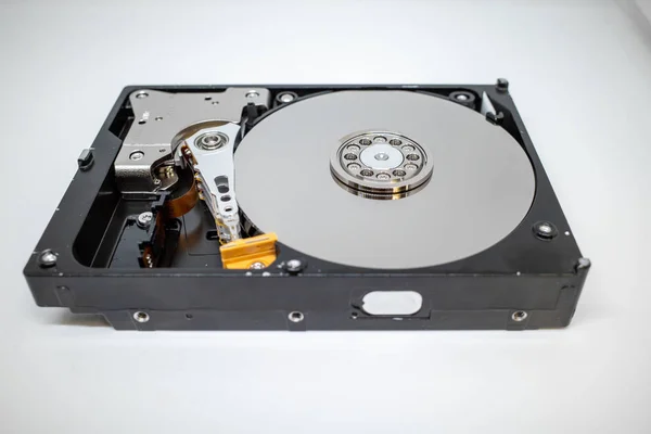A screwed-on hard disk shows the inner workings of a hard disk — ストック写真