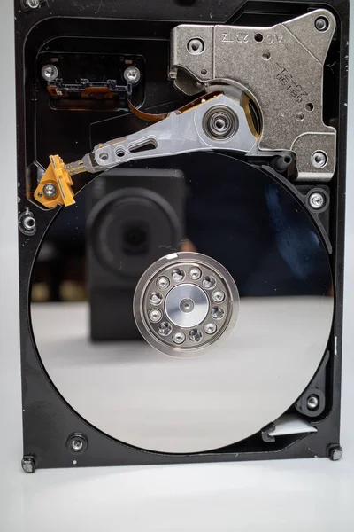 A screwed-on hard disk shows the inner workings of a hard disk — ストック写真