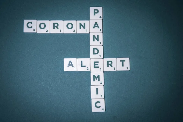 Green Base Game Pieces Letters Form Words Corona Pandemic Alert — Stock Photo, Image