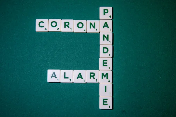 Green Base Game Pieces Letters Form Words Corona Alarm Pandemic — Stock Photo, Image