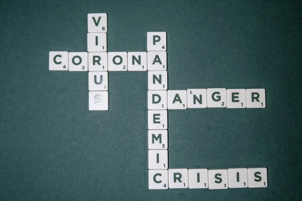 Green Base Game Pieces Letters Form Words Corona Virus Danger — Stock Photo, Image