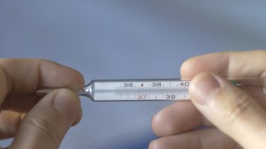 Detail of reset gallium column in fever thermomether