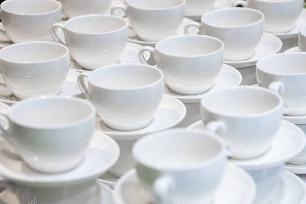 A lot of white cups for coffee. Catering.