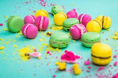 Macaroons on a mint green background. Antigravity. Asymmetry. Art. Minimalism.