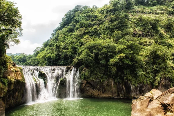 Shifen waterfall scenery, Shifen Waterfall is a scenic waterfall located in Pingxi District, New Taipei City, Taiwan, on the upper reaches of the Keelung River.