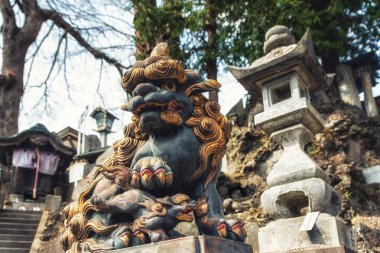 Lion guarding the gate, Narita-san Shinto-ji Temple clipart