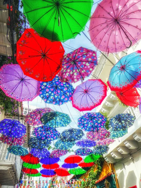 An Alley full of colorful floating Umbrellas — Stock Image An Alley full of colorful floating Umbrellas Royalty Free Stock Images