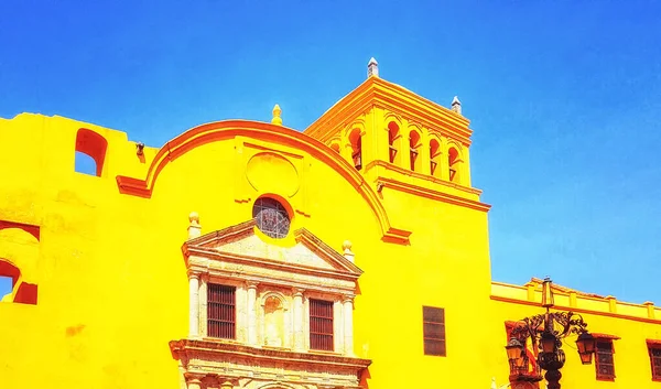 Bright Yellow building at the edge of the old town in colonial Cartagena, Colombia.