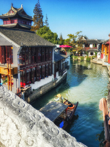Zhujiajiao, China - November 15 2019: Zhujiajiao is an ancient water town located in the Qingpu District of Shanghai. It is well-known throughout China and a popular getaway from Shanghai with both foreign and domestic tourists. The town has a histor