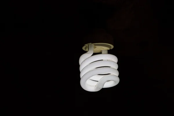 Izzó-lámpák a háttérben — Stock Fotó