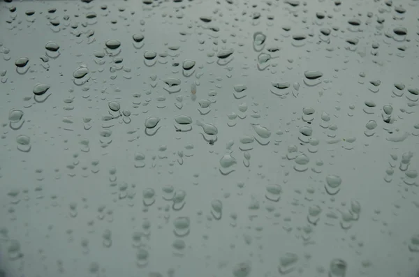 Rain drops on a car window — Stock Photo, Image