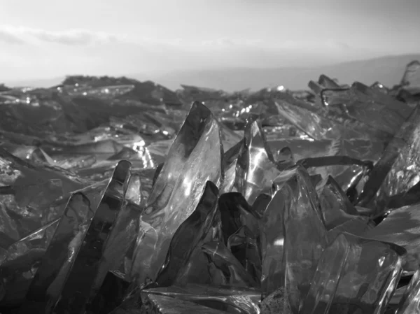 Pieces of ice glisten in the sun. Lake Baikal, Russia. — Stock Photo, Image