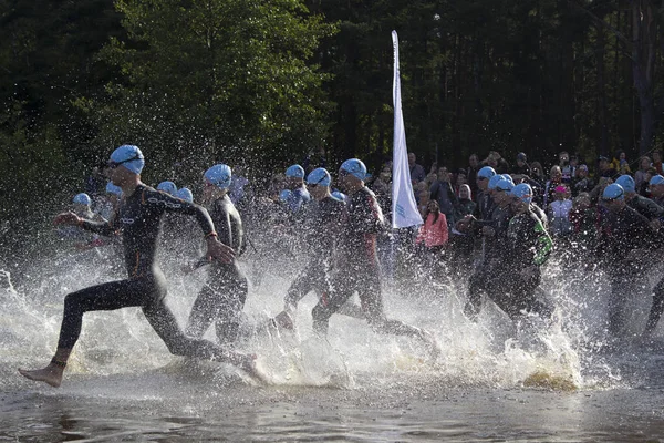 SESTRORETSK, RUSSIA-AUGUST 11-start of triathlon, swimming stage Royalty Free Stock Images