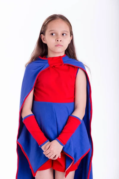 Girl in superhero costume looking worried — Stock Photo, Image