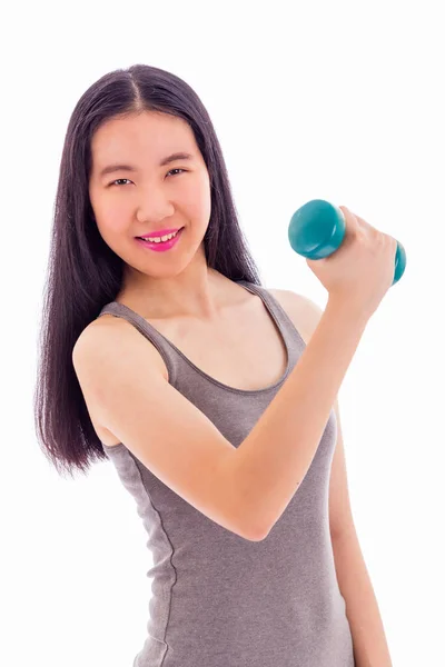 Asian teenager lifting dumbbell — Stock Photo, Image