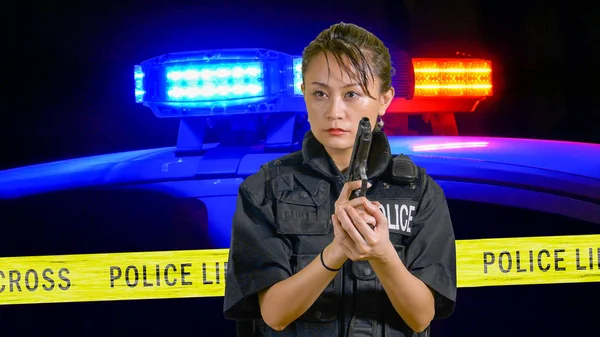 Asian American Policewoman pointing a pistol