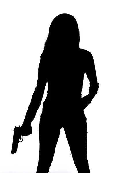 Silhouette di donna con pistola su sfondo bianco — Foto Stock